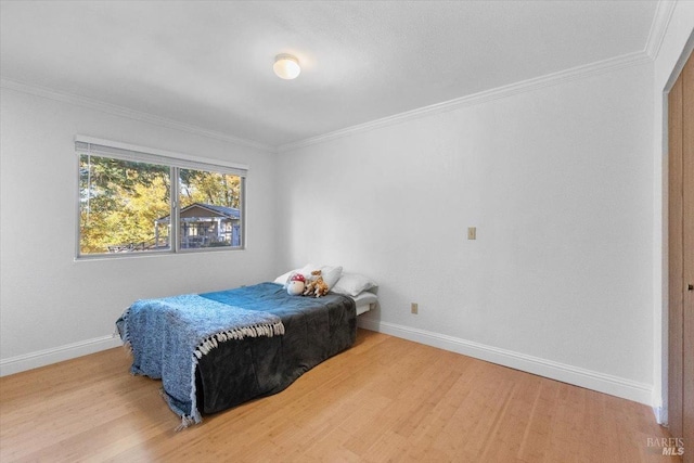 20320 Hollands Ln, Willits, CA 95490 - bedroom with wood finished floors, crown molding, and baseboards