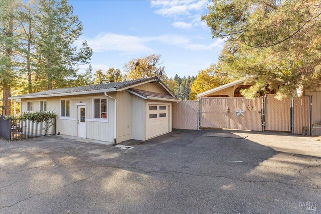 20320 Hollands Ln, Willits, CA 95490 - view of front of house with a gate, asphalt driveway, and a garage