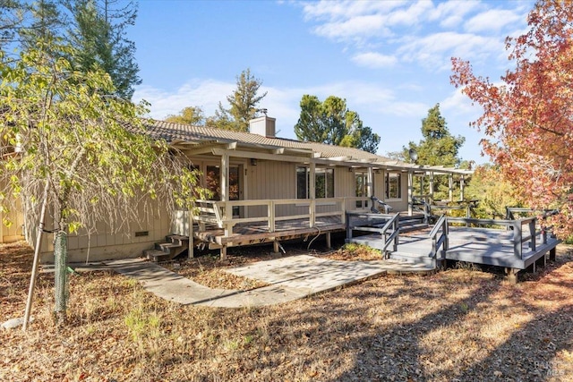 20320 Hollands Ln, Willits, CA 95490 - back of property featuring a wooden deck, a chimney, and crawl space