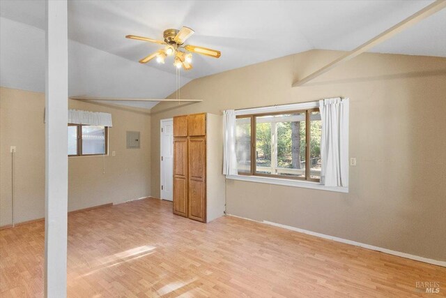 20320 Hollands Ln, Willits, CA 95490 - unfurnished bedroom with lofted ceiling, light wood finished floors, electric panel, and a ceiling fan