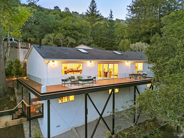 21 Sheridan Ct, Mill Valley, CA 94941 - rear view of house with a deck, a view of trees, a shingled roof, and outdoor dining space