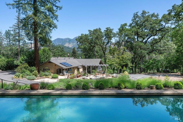 3227 State Highway 128, Calistoga, CA 94515 - outdoor pool with a mountain view and a patio