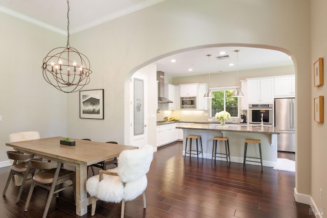 907 Serendipity Way, Napa, CA 94558 - dining room with arched walkways, a chandelier, dark wood-style flooring, recessed lighting, and crown molding