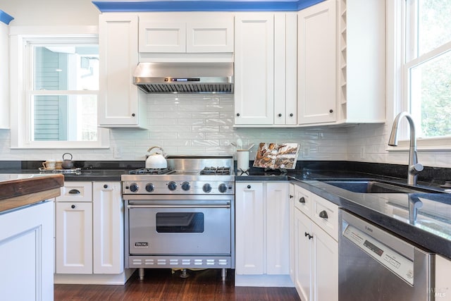 660 S Main St, Sebastopol, CA 95472 - kitchen featuring appliances with stainless steel finishes, wall chimney range hood, a sink, and white cabinetry