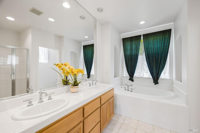 1142 Kellogg St, Suisun City, CA 94585 - bathroom featuring a bath, tile patterned flooring, double vanity, a stall shower, and recessed lighting