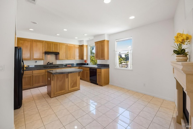 1142 Kellogg St, Suisun City, CA 94585 - kitchen with black appliances, a center island, recessed lighting, under cabinet range hood, and light tile patterned floors