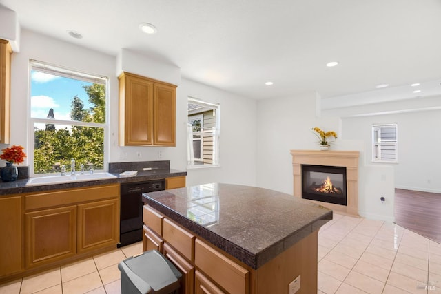 1142 Kellogg St, Suisun City, CA 94585 - kitchen with black dishwasher, tile counters, a sink, plenty of natural light, and recessed lighting