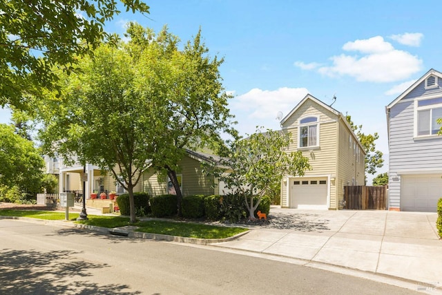 1142 Kellogg St, Suisun City, CA 94585 - view of property hidden behind natural elements featuring concrete driveway and an attached garage