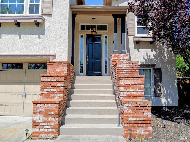 2743 Overlook Dr, Vallejo, CA 94591 - view of exterior entry featuring stucco siding and a garage