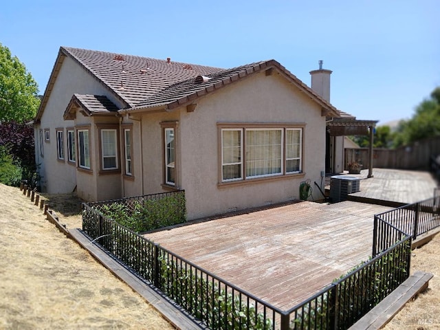 2743 Overlook Dr, Vallejo, CA 94591 - rear view of house featuring a chimney, cooling unit, a deck, and stucco siding