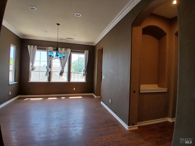 2743 Overlook Dr, Vallejo, CA 94591 - unfurnished dining area with arched walkways, dark wood finished floors, crown molding, a chandelier, and baseboards