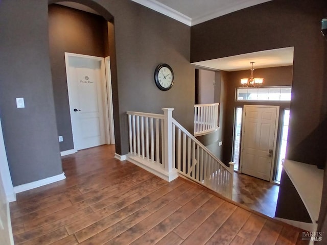 2743 Overlook Dr, Vallejo, CA 94591 - entryway with a chandelier, wood finished floors, arched walkways, baseboards, and ornamental molding