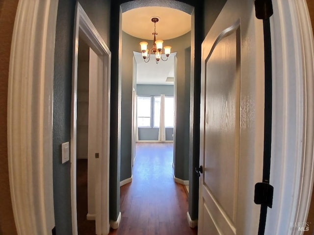 2743 Overlook Dr, Vallejo, CA 94591 - corridor with dark wood-type flooring, a chandelier, and baseboards