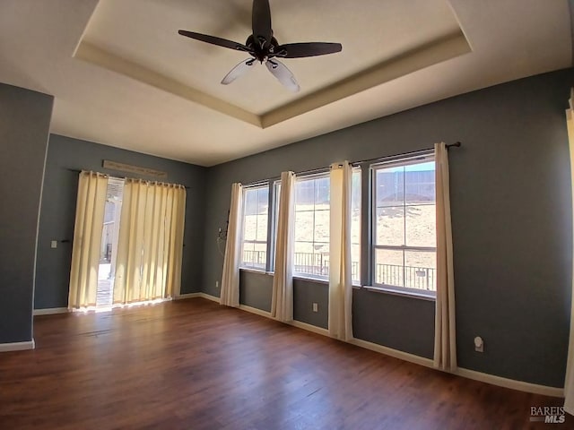 2743 Overlook Dr, Vallejo, CA 94591 - spare room featuring a tray ceiling, wood finished floors, baseboards, and ceiling fan
