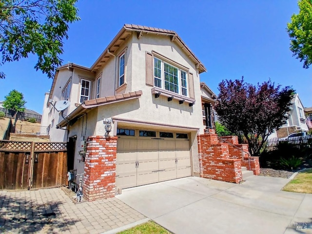 2743 Overlook Dr, Vallejo, CA 94591 - view of front of home featuring an attached garage, stucco siding, and concrete driveway