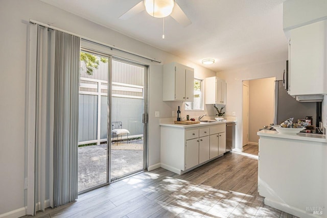 106 Oliva Ct Unit A, Novato, CA 94947 - kitchen with light countertops, stainless steel dishwasher, healthy amount of natural light, and light wood-style flooring