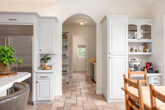 4588 Bennett Valley Rd, Santa Rosa, CA 95404 - kitchen with open shelves, stone tile floors, white cabinetry, and light countertops