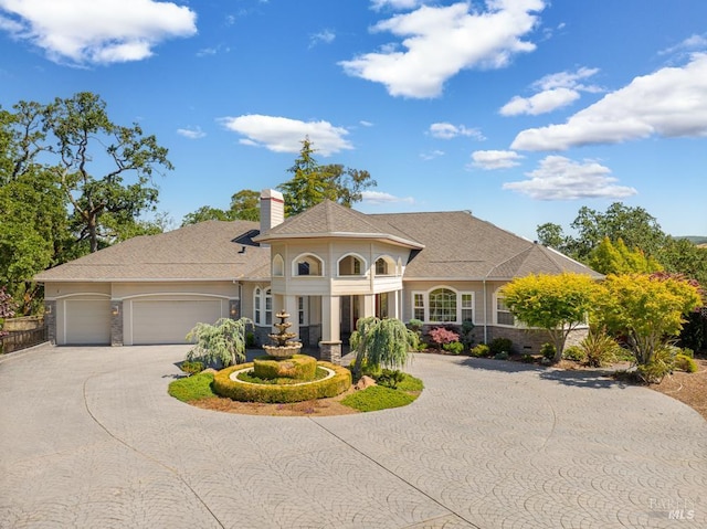 4588 Bennett Valley Rd, Santa Rosa, CA 95404 - view of front facade featuring curved driveway, a garage, and a chimney