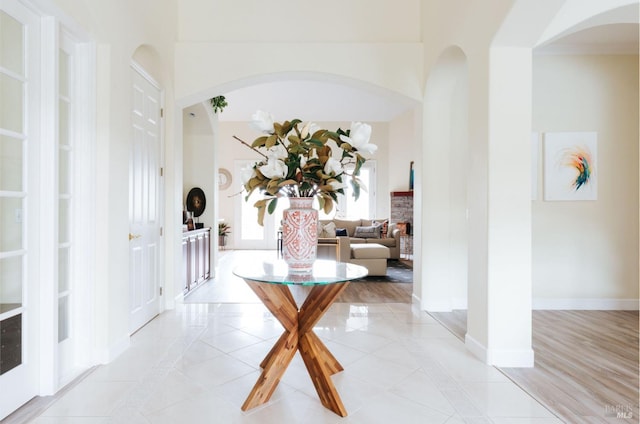 4588 Bennett Valley Rd, Santa Rosa, CA 95404 - corridor featuring inlaid floor details, light tile patterned flooring, and arched walkways