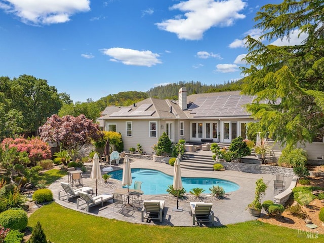 4588 Bennett Valley Rd, Santa Rosa, CA 95404 - back of house with a patio area, an outdoor pool, outdoor lounge area, and a chimney
