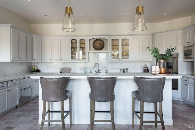 4588 Bennett Valley Rd, Santa Rosa, CA 95404 - kitchen with stainless steel appliances, a kitchen bar, a center island, glass insert cabinets, and recessed lighting