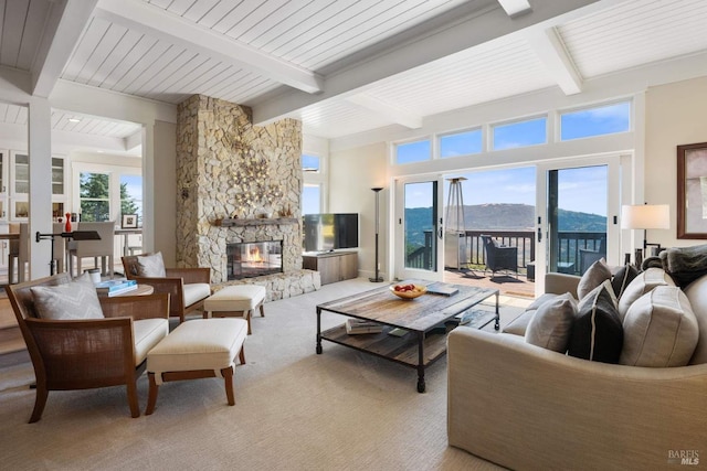 2557 Trinity Rd, Glen Ellen, CA 95442 - living area featuring beam ceiling, a fireplace, and carpet floors