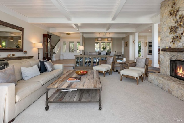 2557 Trinity Rd, Glen Ellen, CA 95442 - carpeted living area with beamed ceiling, a stone fireplace, and stairs