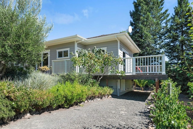 2557 Trinity Rd, Glen Ellen, CA 95442 - view of property exterior with a carport, a wooden deck, and driveway