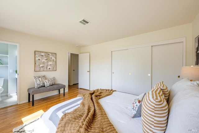 238 Ebbetts Pass Rd, Vallejo, CA 94589 - bedroom featuring a closet, light wood-type flooring, and ensuite bathroom