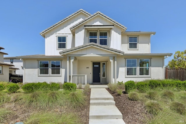 2413 Village Square Blvd, Fairfield, CA 94533 - view of front of home with covered porch, board and batten siding, and stucco siding
