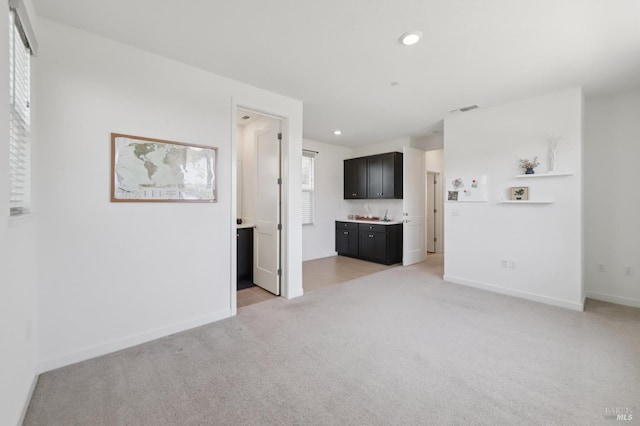 2413 Village Square Blvd, Fairfield, CA 94533 - unfurnished living room featuring light carpet, recessed lighting, and baseboards