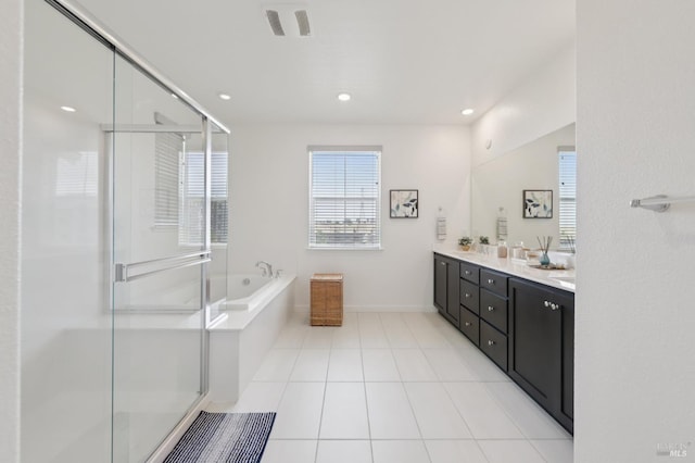 2413 Village Square Blvd, Fairfield, CA 94533 - bathroom with double vanity, a bath, a shower stall, tile patterned floors, and baseboards