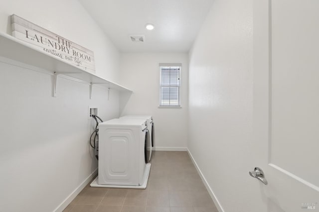 2413 Village Square Blvd, Fairfield, CA 94533 - laundry room with washing machine and dryer, baseboards, and light tile patterned flooring