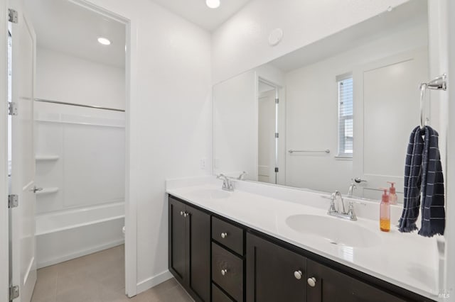 2413 Village Square Blvd, Fairfield, CA 94533 - full bath featuring double vanity, tile patterned flooring, shower / bath combination, and baseboards