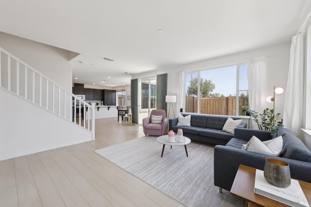 2413 Village Square Blvd, Fairfield, CA 94533 - living area with stairway, light wood-style floors, and recessed lighting