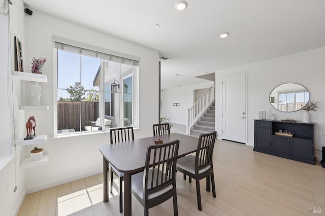 2413 Village Square Blvd, Fairfield, CA 94533 - dining room featuring light wood finished floors, stairway, and recessed lighting