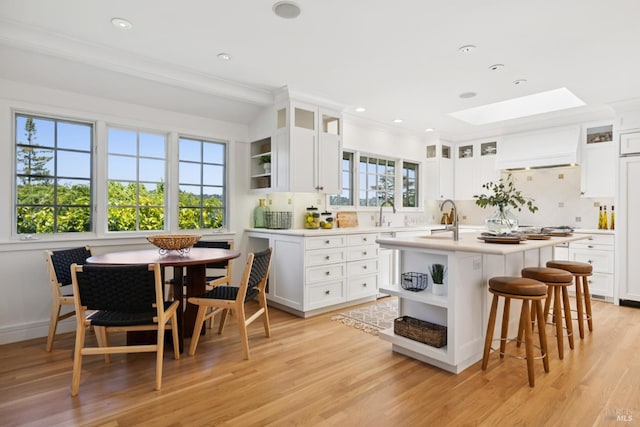 37 Rancheria Rd, Kentfield, CA 94904 - kitchen featuring open shelves, a skylight, decorative backsplash, light countertops, and recessed lighting