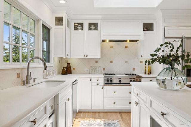 37 Rancheria Rd, Kentfield, CA 94904 - kitchen featuring a sink, stainless steel appliances, custom range hood, decorative backsplash, and white cabinets