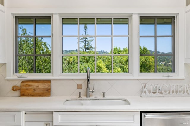 37 Rancheria Rd, Kentfield, CA 94904 - kitchen with dishwasher, a sink, tasteful backsplash, and white cabinets