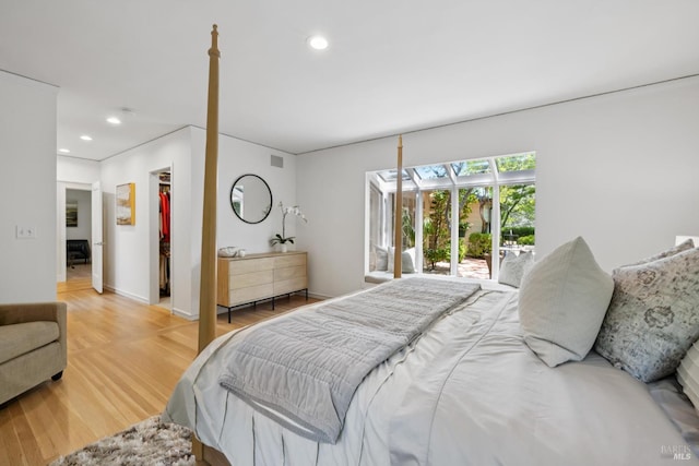 37 Rancheria Rd, Kentfield, CA 94904 - bedroom with a walk in closet, recessed lighting, wood finished floors, access to exterior, and baseboards