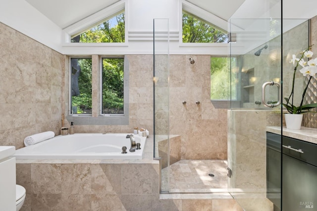 37 Rancheria Rd, Kentfield, CA 94904 - bathroom featuring vaulted ceiling, a garden tub, vanity, a shower stall, and tile walls