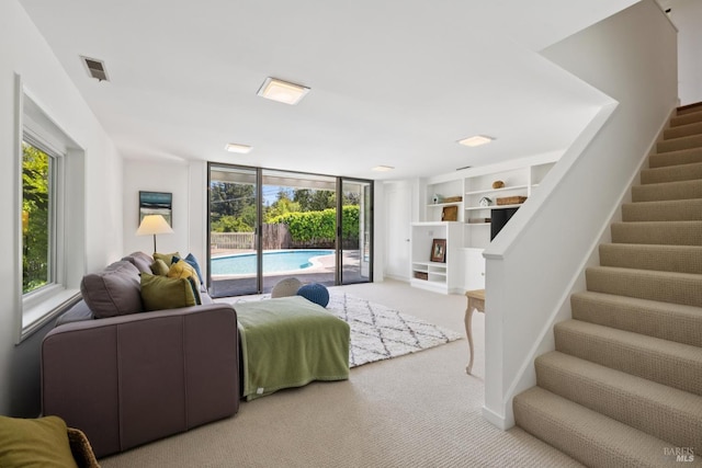37 Rancheria Rd, Kentfield, CA 94904 - living room featuring plenty of natural light, carpet flooring, stairs, and built in shelves