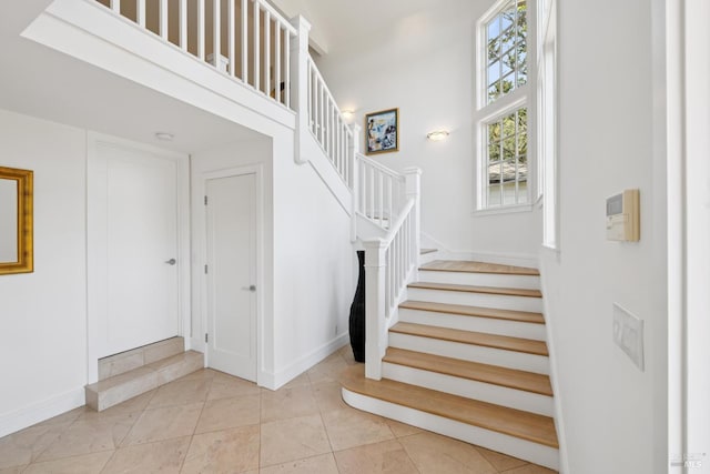 37 Rancheria Rd, Kentfield, CA 94904 - staircase with baseboards and tile patterned floors