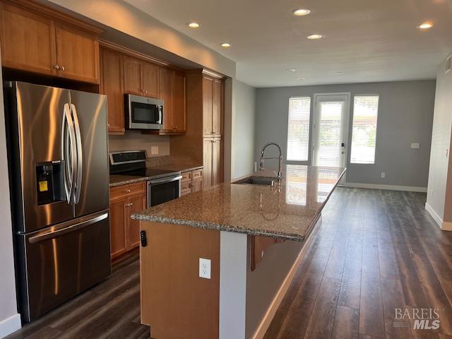 126 Johnson St, Windsor, CA 95492 - kitchen featuring stainless steel appliances, a sink, brown cabinetry, recessed lighting, and dark wood-type flooring