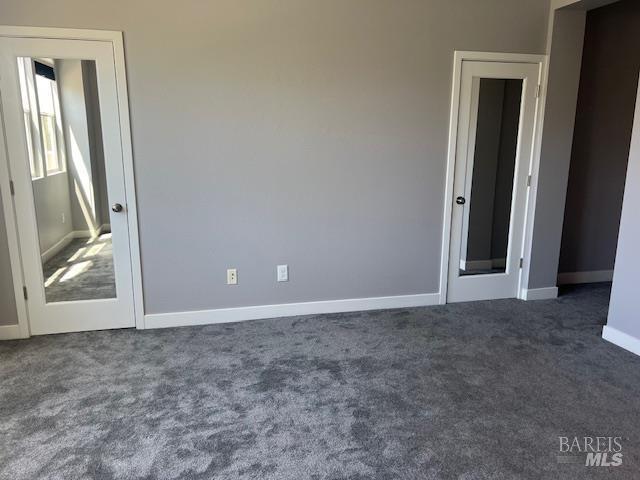 126 Johnson St, Windsor, CA 95492 - unfurnished bedroom featuring dark carpet and baseboards