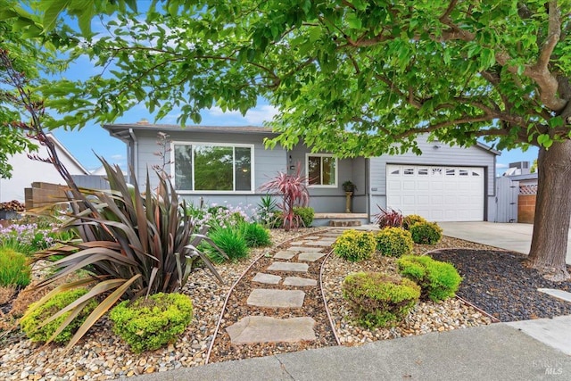 view of front of home featuring an attached garage and concrete driveway
