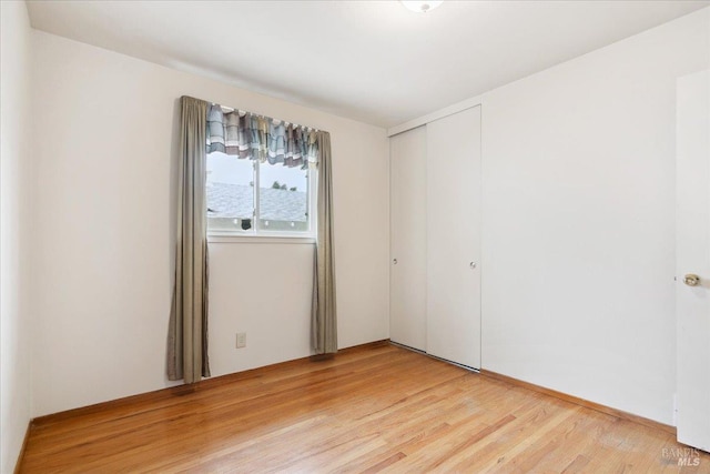spare room with light wood-style flooring