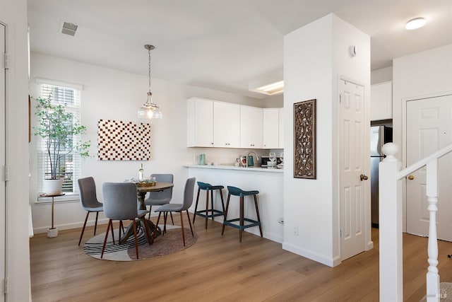 306 Commodore Dr, Richmond, CA 94804 - dining room with light wood-type flooring and baseboards