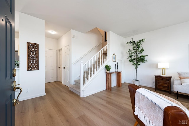 306 Commodore Dr, Richmond, CA 94804 - entryway with light wood-type flooring and stairs
