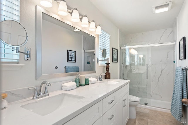 306 Commodore Dr, Richmond, CA 94804 - bathroom with a marble finish shower, double vanity, and tile patterned floors